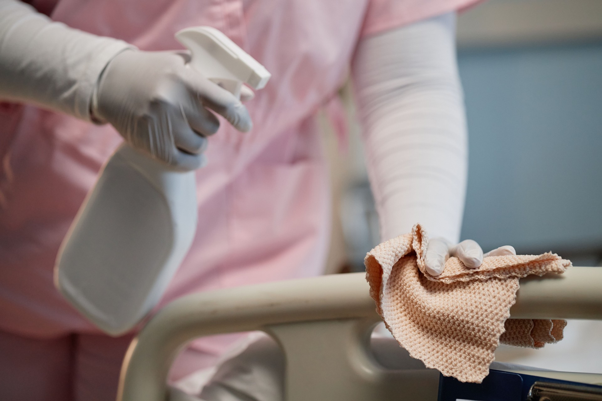 Cleaning Hospital Bed with Disinfectant Spray and Cloth